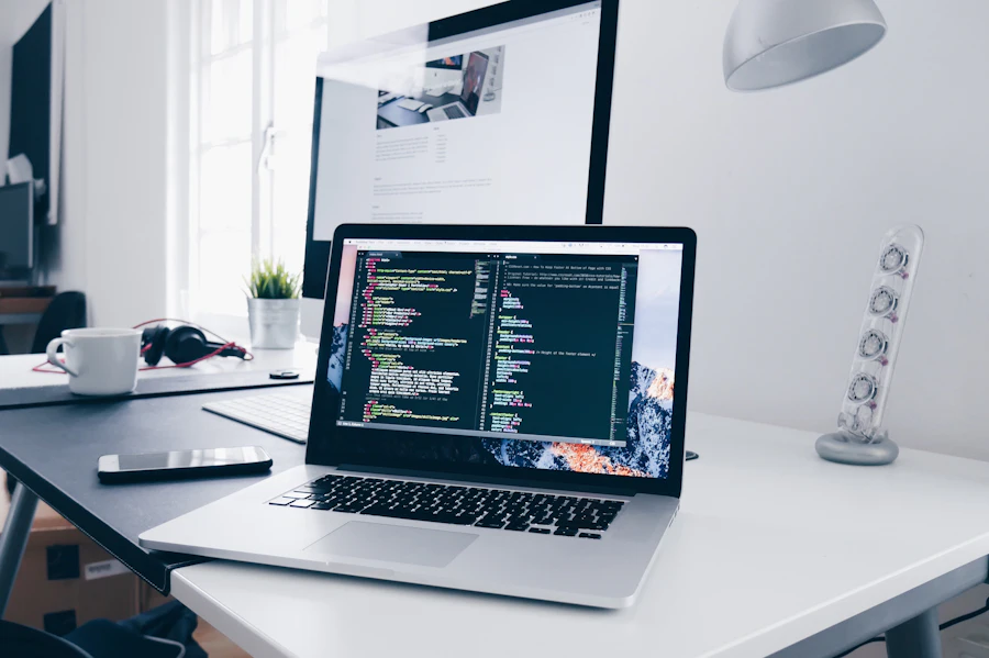Developer workspace with code open on a laptop
