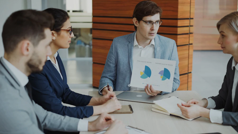 Colleagues analysing documents together at a meeting table