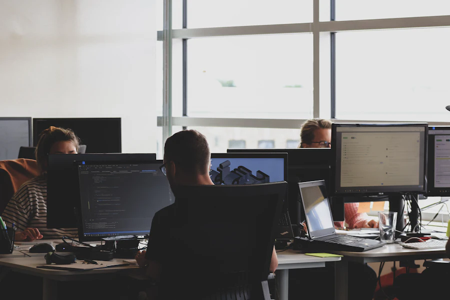 Software team working at desks in a bright open office