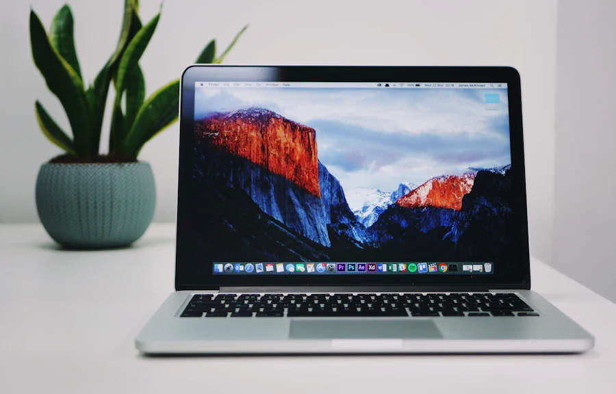 Laptop on a bright desk showing a modern website