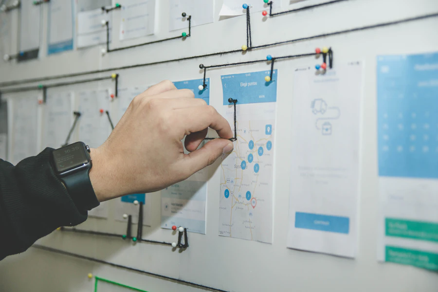 Team mapping an office workflow on a whiteboard